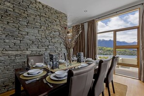 Enjoy meals with a view of the surrounding mountains and water from this dining area.