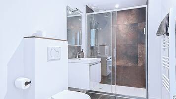 Shower, towels, soap, toilet paper