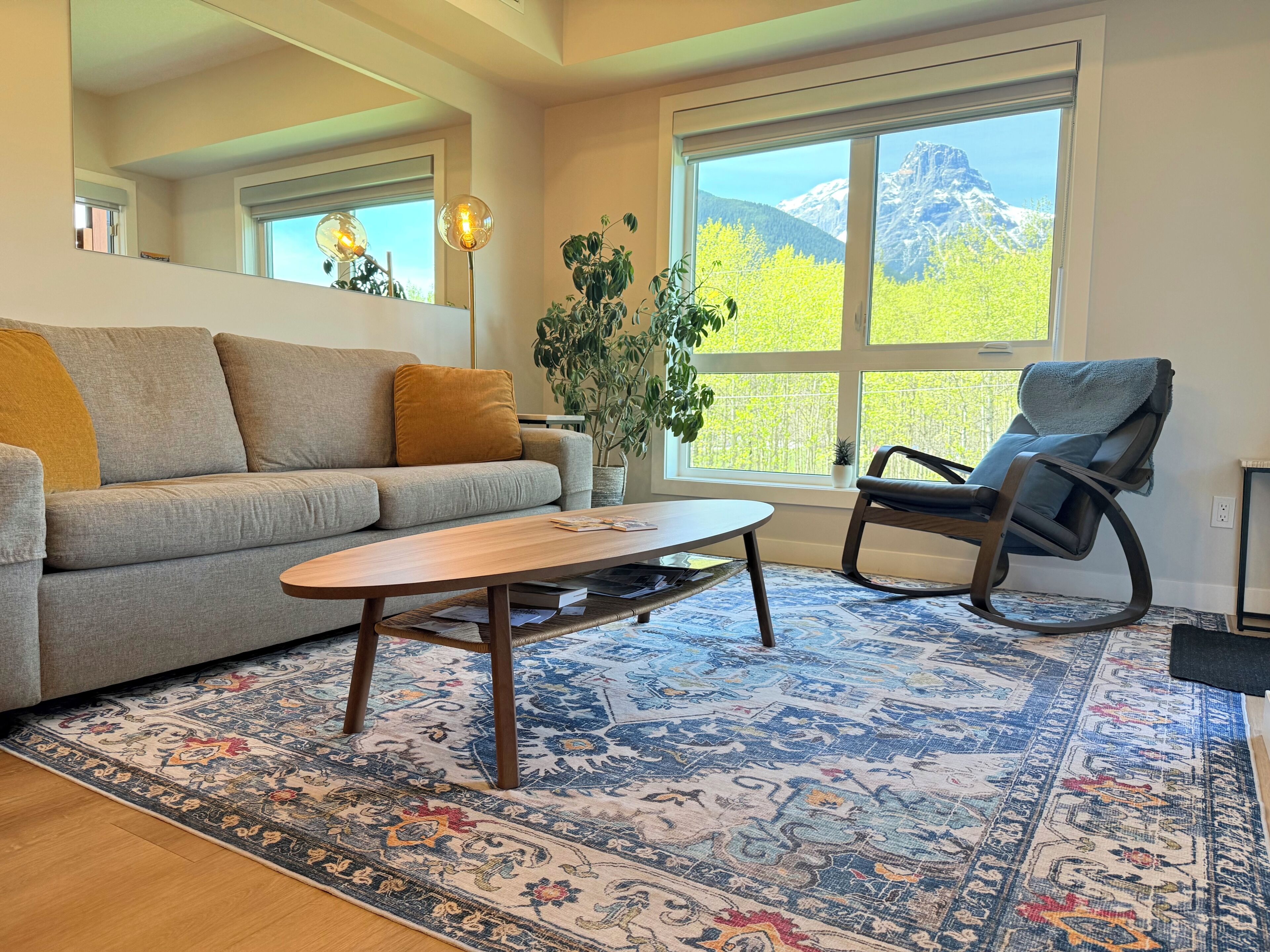 Living Room w Sofa Bed, Smart TV, Electric Fireplace and Beautiful Window View.