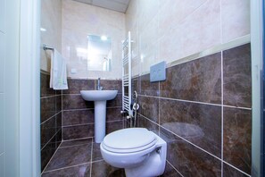 Shower, free toiletries, slippers, towels