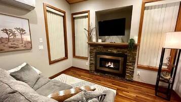 Smart TV, fireplace, books, offices