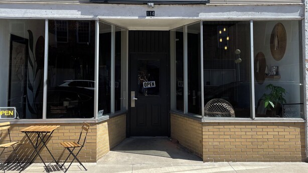 A storefront with a sign reading "wild BREW" and a number "114" above the entrance. - The Adolphus - 4 Bedrooms, 2 Baths. Sleeps 8 comfortably!  (Oak Harbor)