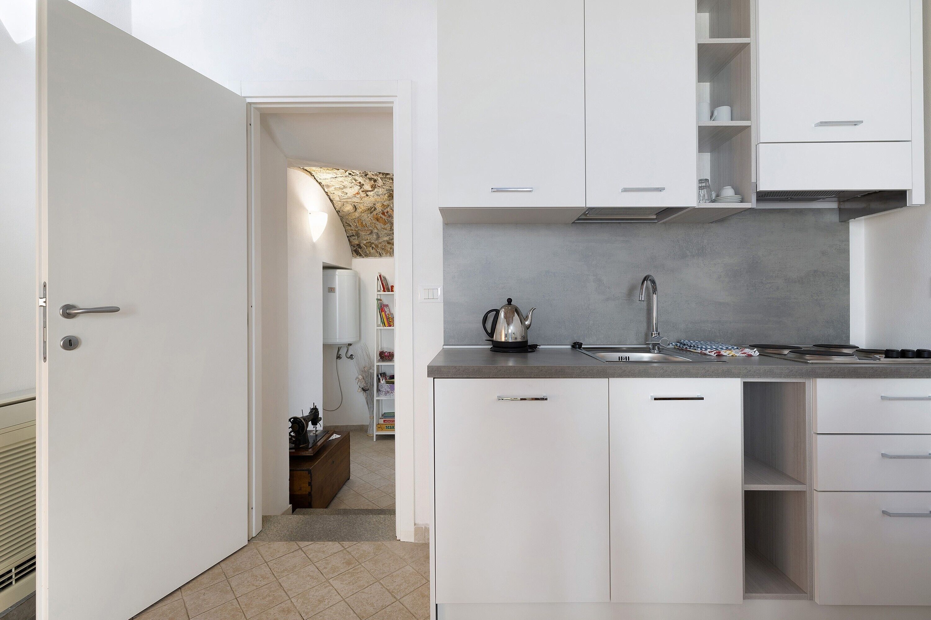 Fridge, stovetop, electric kettle, cookware/dishes/utensils