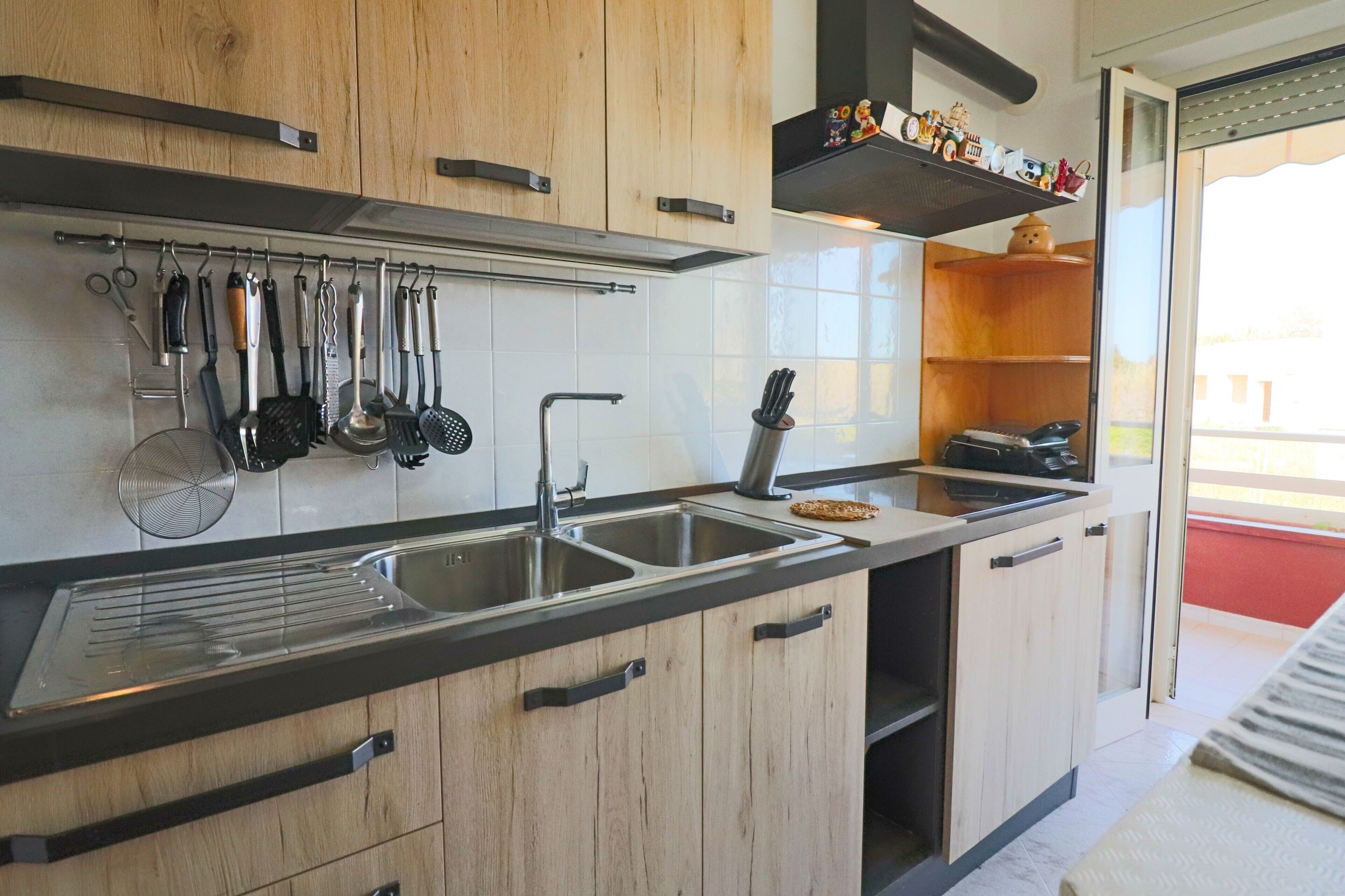Fridge, stovetop, high chair, cookware/dishes/utensils