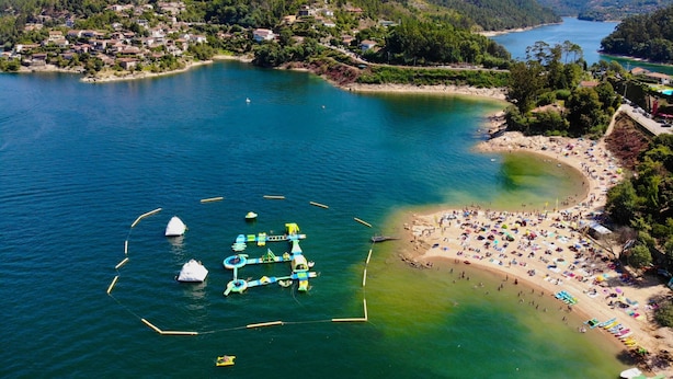 An aerial view of a coastal area with a beach, a water park, and a residential area with houses. - YourHouse A Casa Da Corona, beautiful country house (Ourense)
