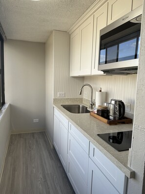 Fridge, microwave, stovetop, coffee/tea maker