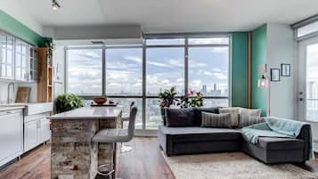 Comfort Condo | Living area | 55-inch Smart TV with digital channels, Netflix, streaming services