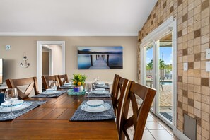 Dining - Poolside Paradise -heated pool, hot tub and game room! Waterfront Canal Views!  (Cape Coral)