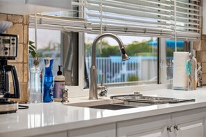 Fridge, microwave, oven, stovetop - Poolside Paradise -heated pool, hot tub and game room! Waterfront Canal Views!  (Cape Coral)