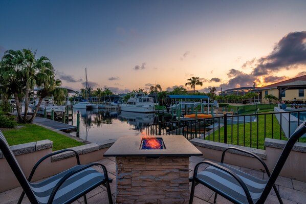 Terrace/patio - Poolside Paradise -heated pool, hot tub and game room! Waterfront Canal Views!  (Cape Coral)