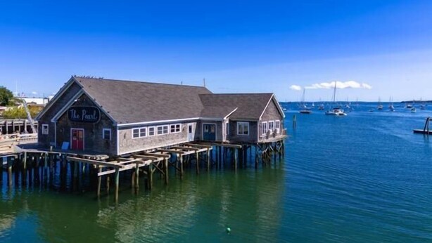 A waterfront building with a sign reading 'The Pearl' on a pier extending into the water. - Rockland Central Loft, heart of downtown (Rockland)