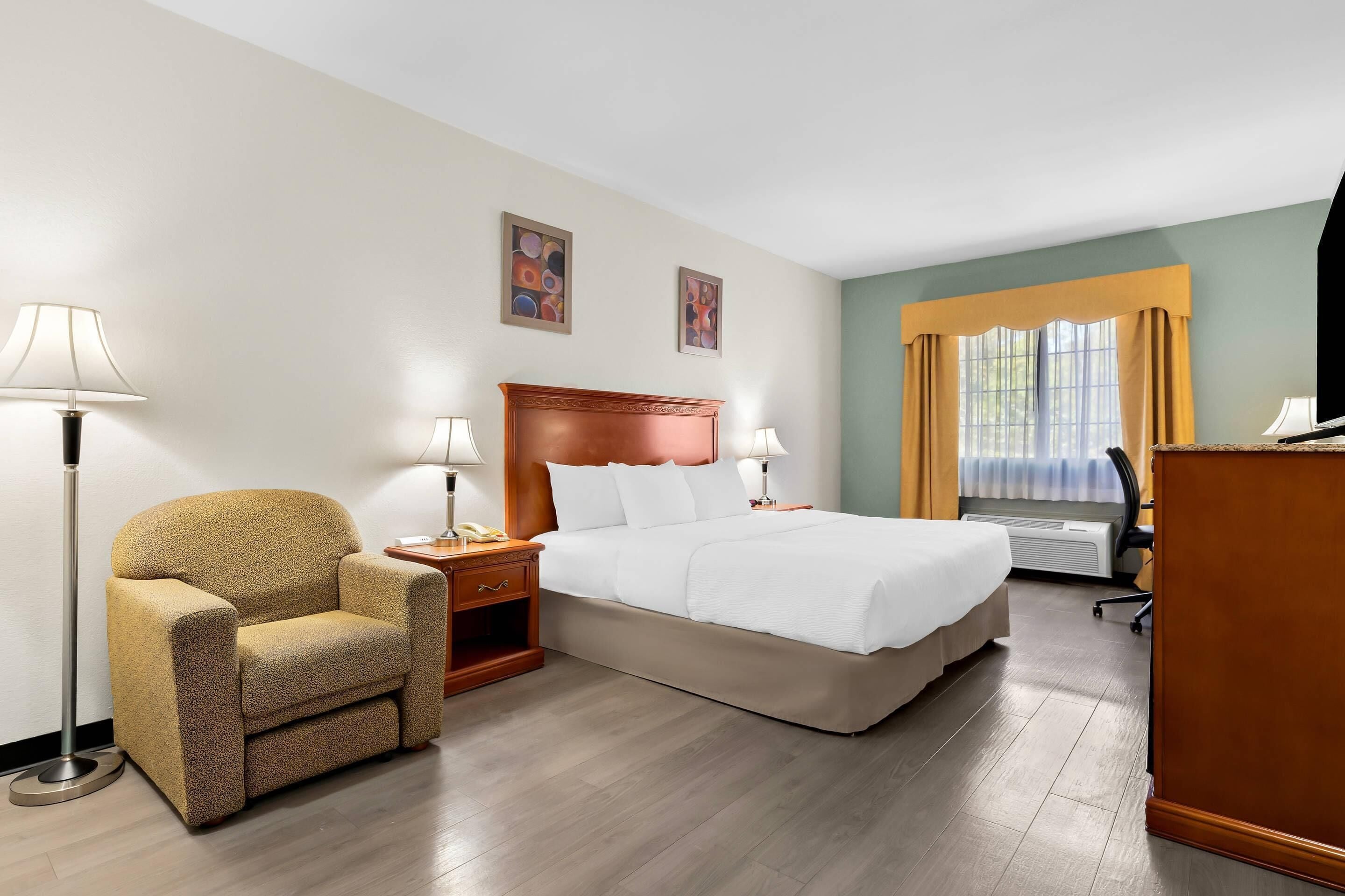 Premium bedding, desk, laptop workspace, iron/ironing board