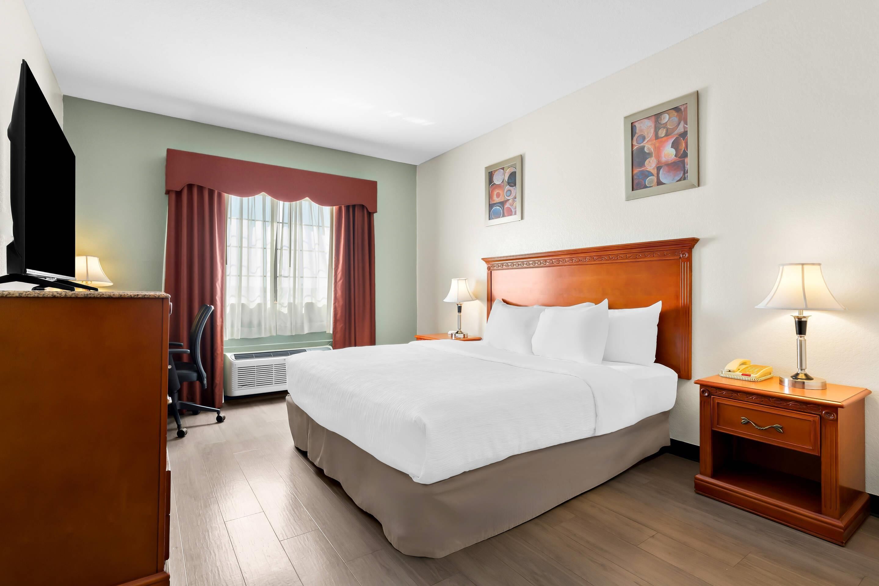 Premium bedding, desk, laptop workspace, iron/ironing board