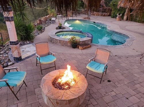 Beautiful luxurious house looking at canyon and mountains, gorgeous sunset.