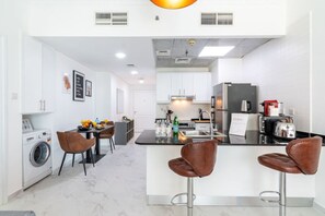 Cookware/dishes/utensils - Stylish 1BR Apartment with City View, Balcony, Pool, and Parking (Marina)
