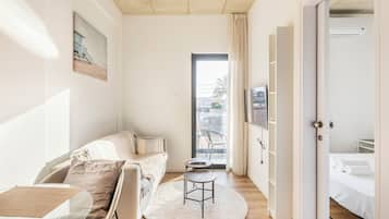 City Apartment | Living area | 42-inch Smart TV with digital channels