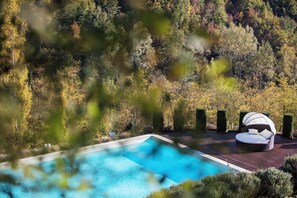 Seasonal outdoor pool, open 9:00 AM to 7:30 PM, pool umbrellas