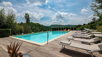 Seasonal outdoor pool, open 9:00 AM to 7:30 PM, pool umbrellas