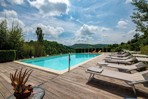 Seasonal outdoor pool, open 9:00 AM to 7:30 PM, pool umbrellas