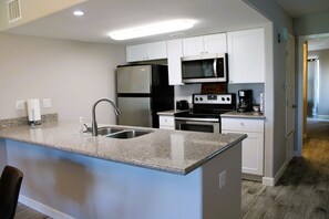 Coffee/tea maker, fridge, microwave, oven - Condo located at Bayfront (Rockport)