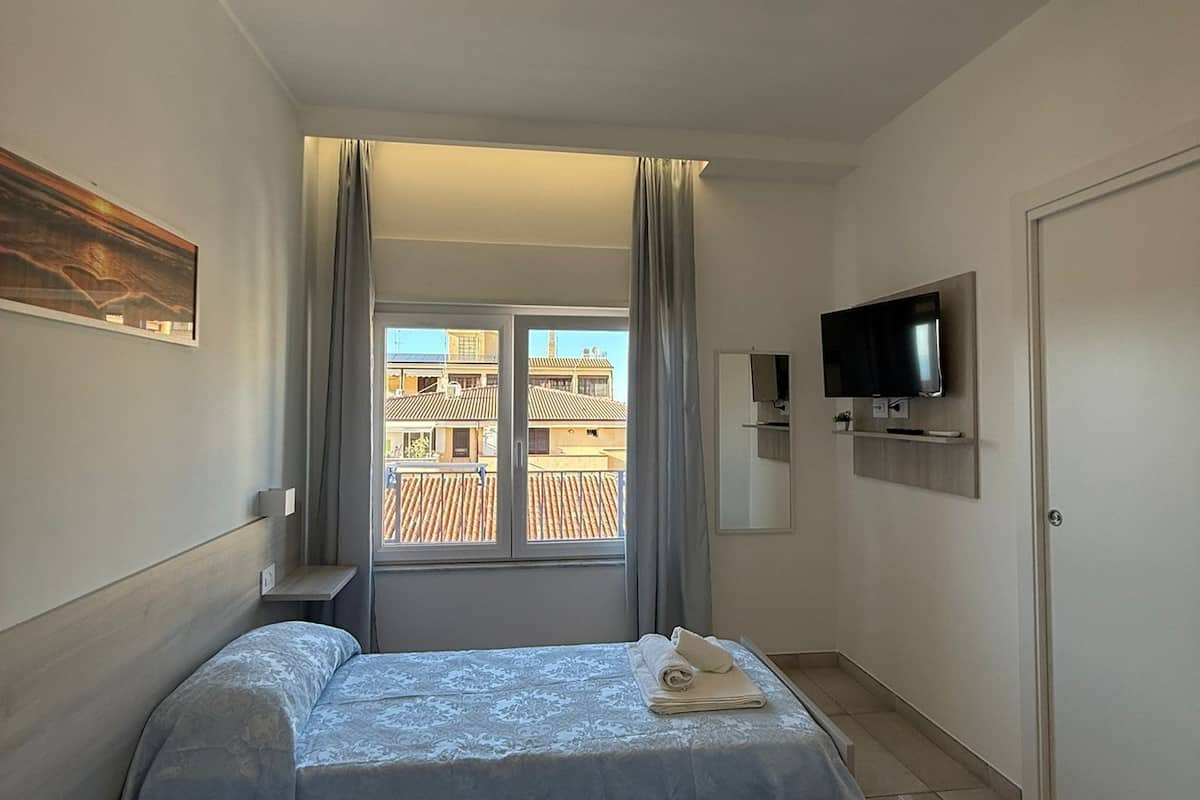 Economy Double or Twin Room, Sea View | Minibar, in-room safe, desk, laptop workspace