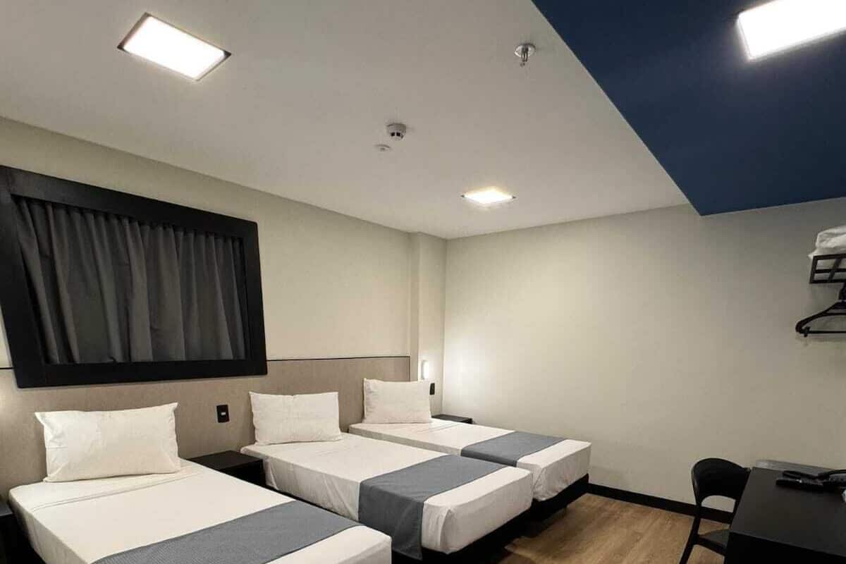 Standard Triple Room | In-room safe, desk, laptop workspace, blackout curtains