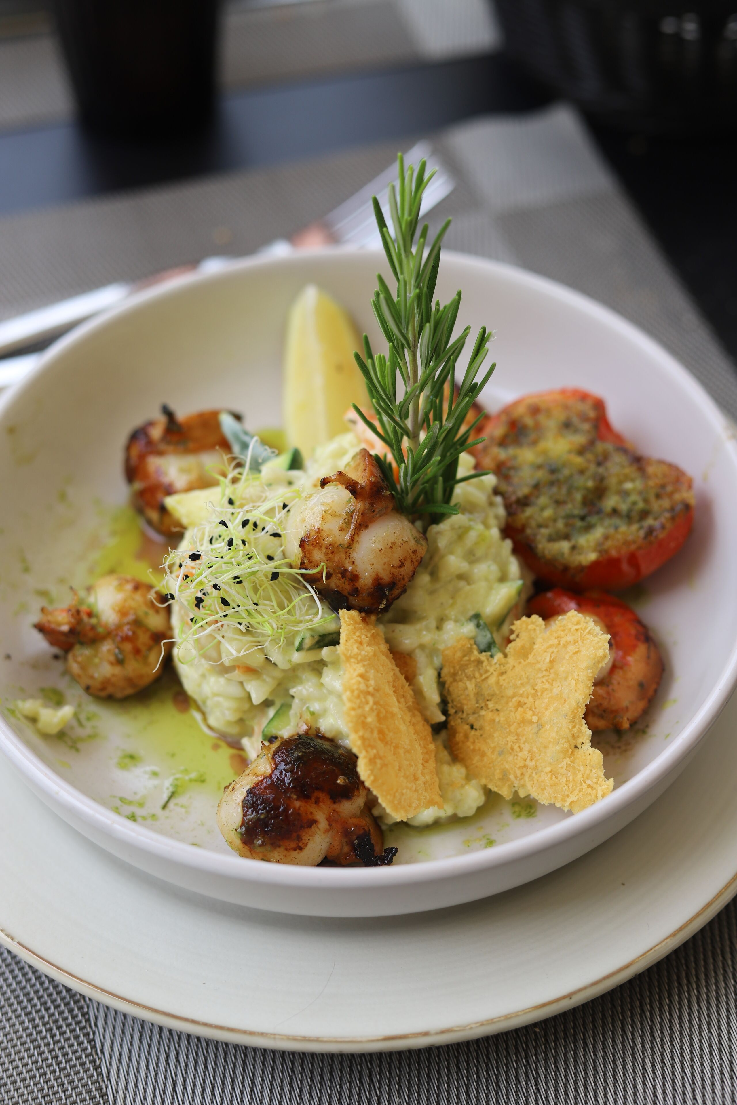 A bowl of food with various ingredients.
