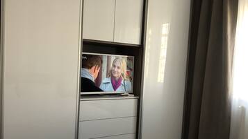 1 bedroom, desk, iron/ironing board, bed sheets