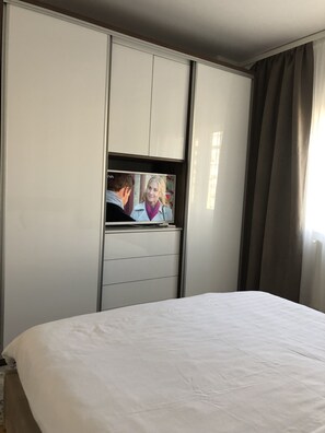 1 bedroom, desk, iron/ironing board, bed sheets