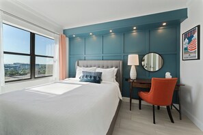 Queen bedroom with city views and a stylish teal accent wall - Modern 2Bed/2Bath Home w/Private Terrace & Kitchen - Apartment (Orlando)