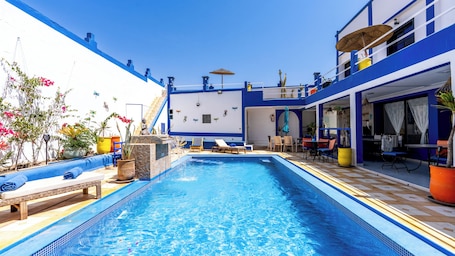 Outdoor pool, open 8:00 AM to 10:00 PM, pool umbrellas, sun loungers