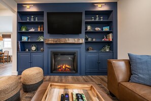 Smart TV, fireplace, books