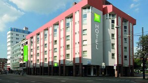 A modern hotel building with a prominent "HOTEL" sign, multiple floors, and a visible entrance. - B&B Hotel Bremen-altstadt (Bremen)