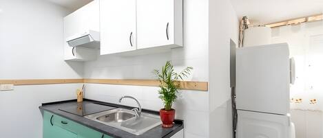 Mini-fridge, microwave, espresso maker, dining tables