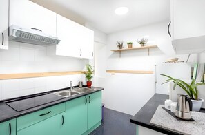 Mini-fridge, microwave, espresso maker, dining tables