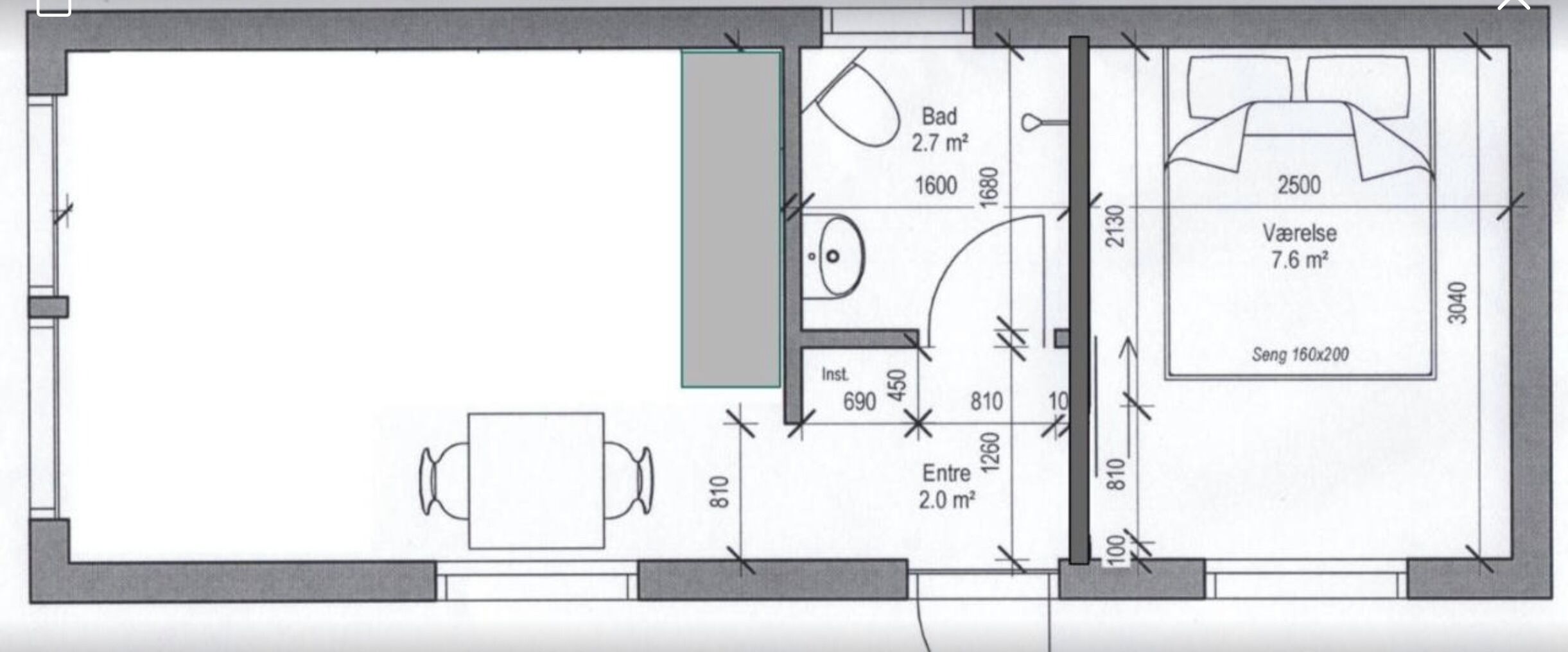 A floor plan with a dining area, a bathroom, a kitchenette, and a living area.