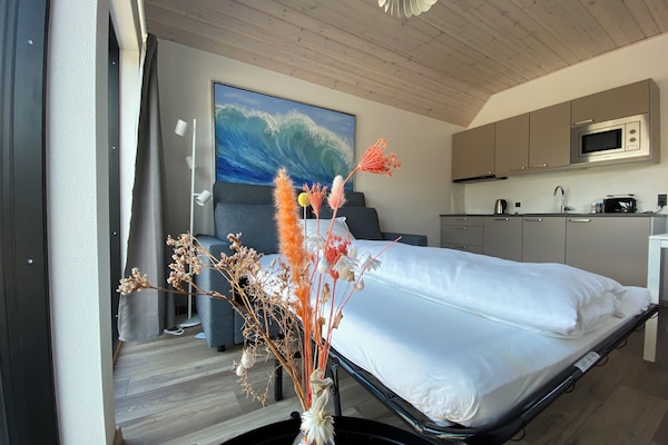 Family Quadruple Room | Living area | Flat-screen TV