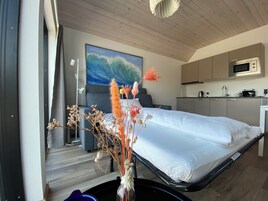 Family Quadruple Room | Living area | Flat-screen TV