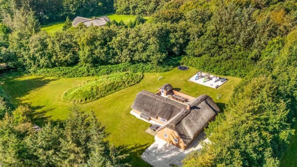An aerial view of a rural property with a large house surrounded by dense forest. - Stunning home in Ulfborg with sauna (Ulfborg)