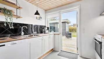Fridge, stovetop, dishwasher, coffee/tea maker