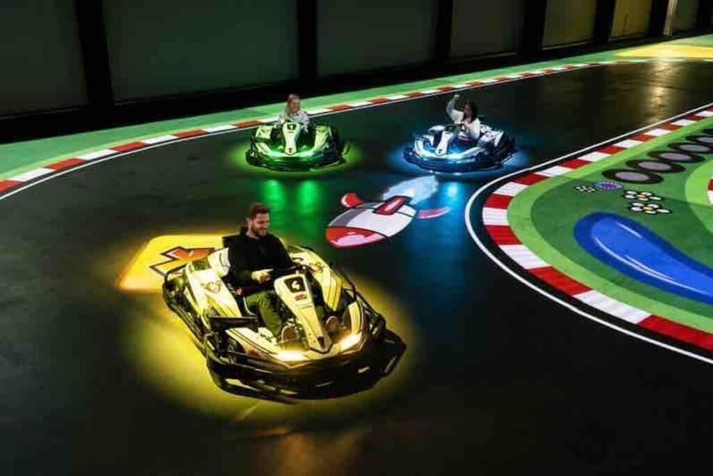 A bumper car ride with three cars in motion.