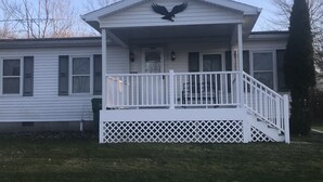 A house with a front porch, a mailbox, and a mailbox on the side. - Quiet, 3 bedroom & 1 bath get-a-way. Near Lake Erie for fishing & skiing resorts (Albion)