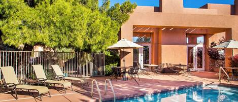 Seasonal outdoor pool, open 8:00 AM to 10:00 PM, pool umbrellas