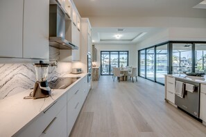 Fridge, microwave, oven, stovetop - Experience Unparalleled Luxury and Serenity at Villa Soulside, Cape Coral, FL (Cape Coral)