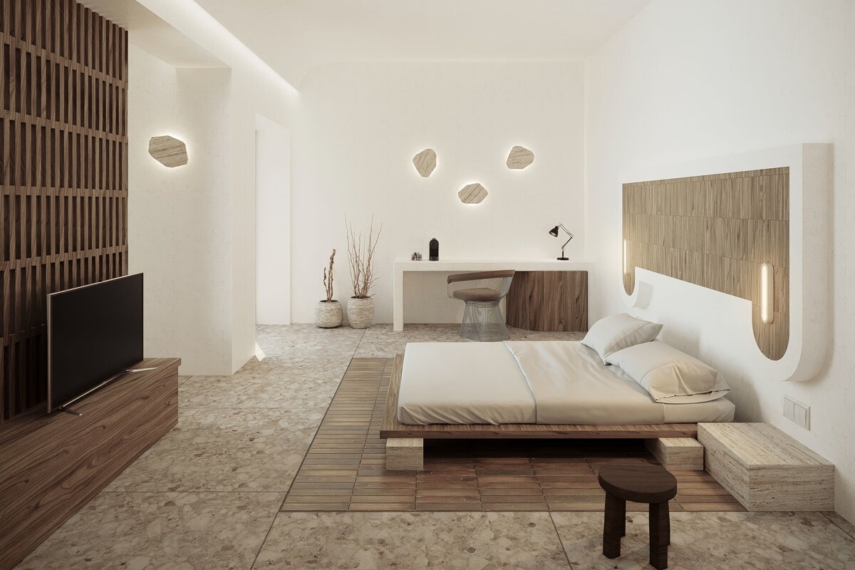 A modern bedroom with a bed, a desk, a TV, and a wooden wall.