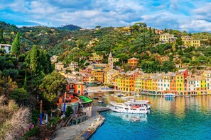 A coastal town with colorful buildings, a marina, and a hilltop view. - Sea View Apartment Next To Acquarium (Genoa)