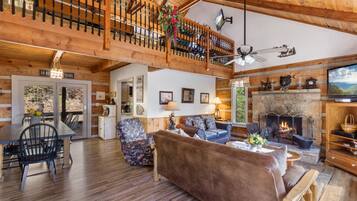 Comfort Cabin, 2 Bedrooms, Non Smoking, Hot Tub | Living room | 50-inch Smart TV with digital channels, fireplace