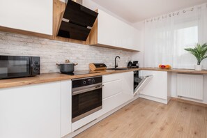 Apartment, 1 Bedroom, Kitchen | Private kitchen | Microwave, oven, dishwasher, espresso maker - Private Garden Apartment by Renters (Gdansk)