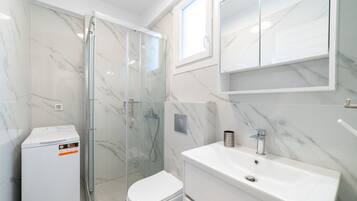 Shower, hair dryer, towels