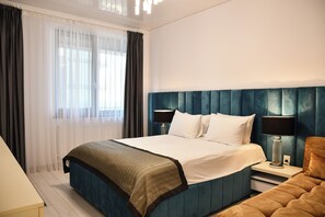 Family Apartment, Partial Ocean View | 1 bedroom, blackout drapes, soundproofing, iron/ironing board